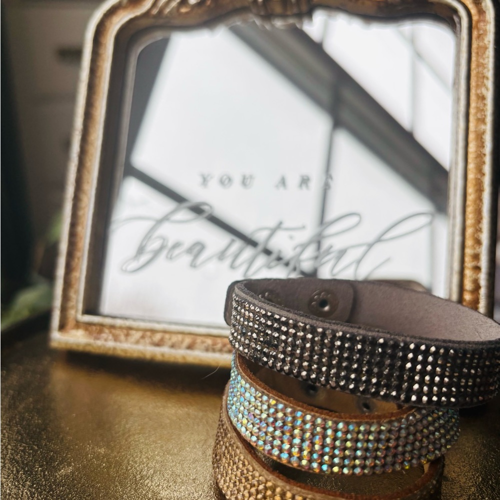 Set of three gem encrusted leather cuff bracelets